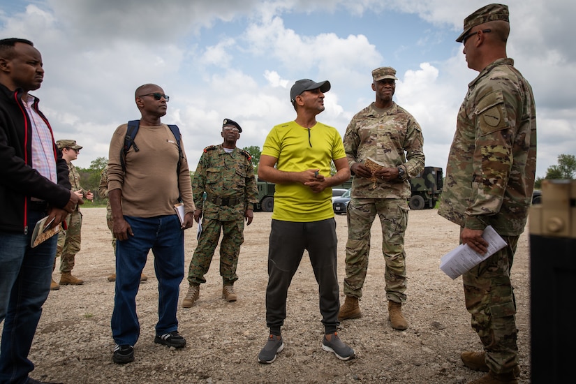 U.S. Army Col. J.B. Richmond (far right), the liaison officer for the Kentucky National Guard, talks with engineer officers of the Djibouti Armed Forces (DAF) at Camp Dodge, Iowa on May 14, 2024. The DAF visited the Kentucky Army National Guard's 206th Engineer Battalion's annual training to learn ideas on how to set up battalion level engineer operations. (U.S. Army National Guard photo by Sgt. 1st Class Andrew Dickson)