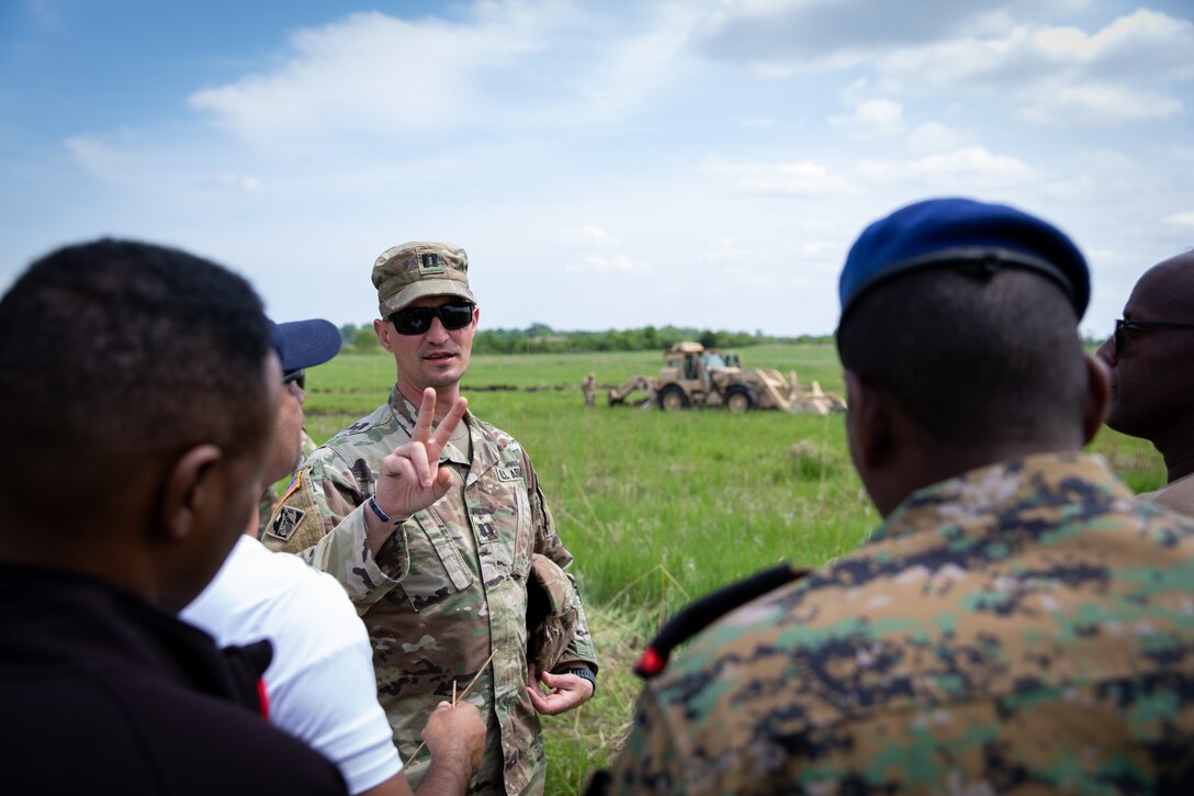 U.S. Army Col. J.B. Richmond (far right), the liaison officer for the Kentucky National Guard, talks with engineer officers of the Djibouti Armed Forces (DAF) at Camp Dodge, Iowa on May 14, 2024. The DAF visited the Kentucky Army National Guard's 206th Engineer Battalion's annual training to learn ideas on how to set up battalion level engineer operations. (U.S. Army National Guard photo by Sgt. 1st Class Andrew Dickson)