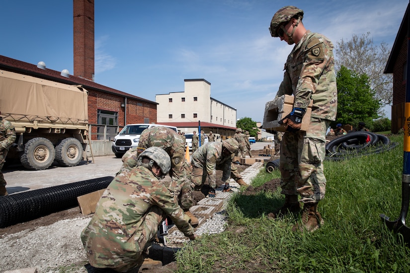 Engineers with the 130th Engineer support Company, 206th Engineer Battalion, Kentucky National Guard, constructing a retaining wall at Camp Dodge, Iowa on May 15, 2024. The 206th Engineer Battalion worked on various construction projects at Camp Dodge for their annual training.  (U.S. Army National Guard photo by Sgt. 1st Class Andrew Dickson)