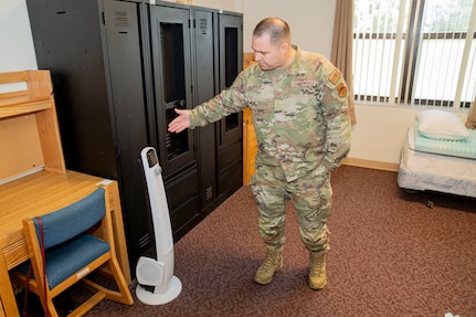 U.S. Air Force Tech. Sgt. Clinton Doriocourt, 334th Training Squadron Radar, Airfield & Weather Systems Specialist instructor, gives a tour of a modified room for the 334th TRS sleep study on Keesler Air Force Base, June 20, 2024.