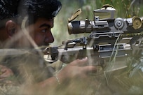 U.S. Army Sgt. Victor Don-Martinez, a forward observer with Headquarters and Headquarters Battery, 1st Battalion, 113th Field Artillery Regiment, North Carolina Army National Guard, engages targets with the XM7 rifle and XM157 scope during testing of the rifle and scope at Fort Liberty, North Carolina, as part of the Next Generation Squad Weapon system, June 13, 2024.