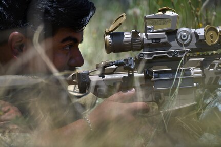 U.S. Army Sgt. Victor Don-Martinez, a forward observer with Headquarters and Headquarters Battery, 1st Battalion, 113th Field Artillery Regiment, North Carolina Army National Guard, engages targets with the XM7 rifle and XM157 scope during testing of the rifle and scope at Fort Liberty, North Carolina, as part of the Next Generation Squad Weapon system, June 13, 2024.