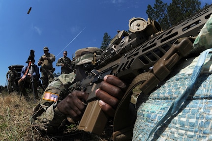 U.S. Army Sgt. Shandell Green, a scout with B Company, 1st Squadron, 150th Cavalry Regiment, West Virginia Army National Guard, engages targets with the XM7 rifle and XM157 scope, part of the Next Generation Squad Weapon system, during testing of the rifle and scope at Fort Liberty, North Carolina, June 13, 2024. The system includes the XM7 rifle, the XM250 automatic rifle, and the XM157 fire control system, which are designed to replace the current M4 carbine, M249 Squad Automatic Weapon, and the M240 machine gun.