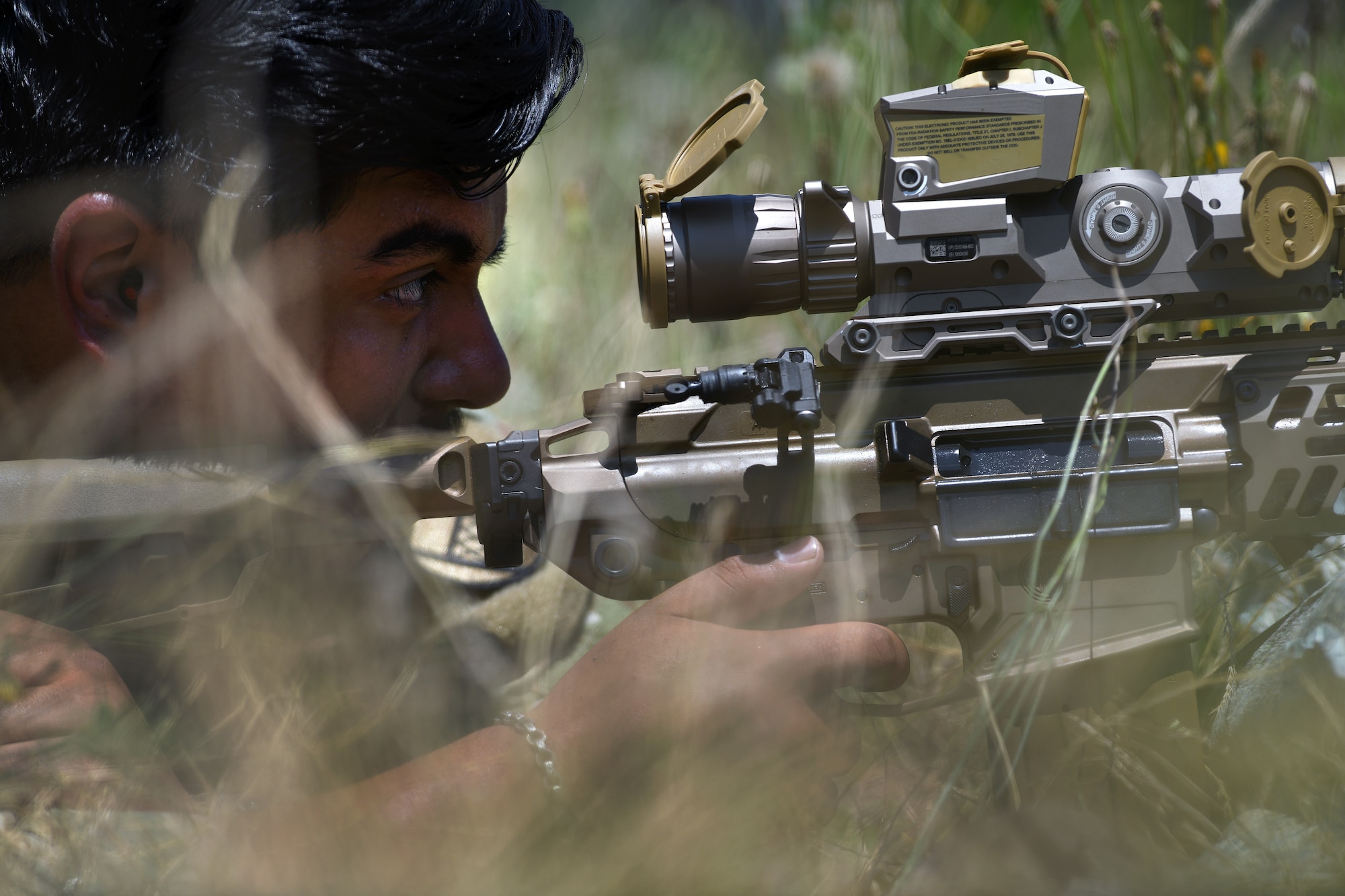 U.S. Army Sgt. Victor Don-Martinez, a forward observer with Headquarters and Headquarters Battery, 1st Battalion, 113th Field Artillery Regiment, North Carolina Army National Guard, engages targets with the XM7 rifle and XM157 scope during testing of the rifle and scope at Fort Liberty, North Carolina, as part of the Next Generation Squad Weapon system, June 13, 2024.