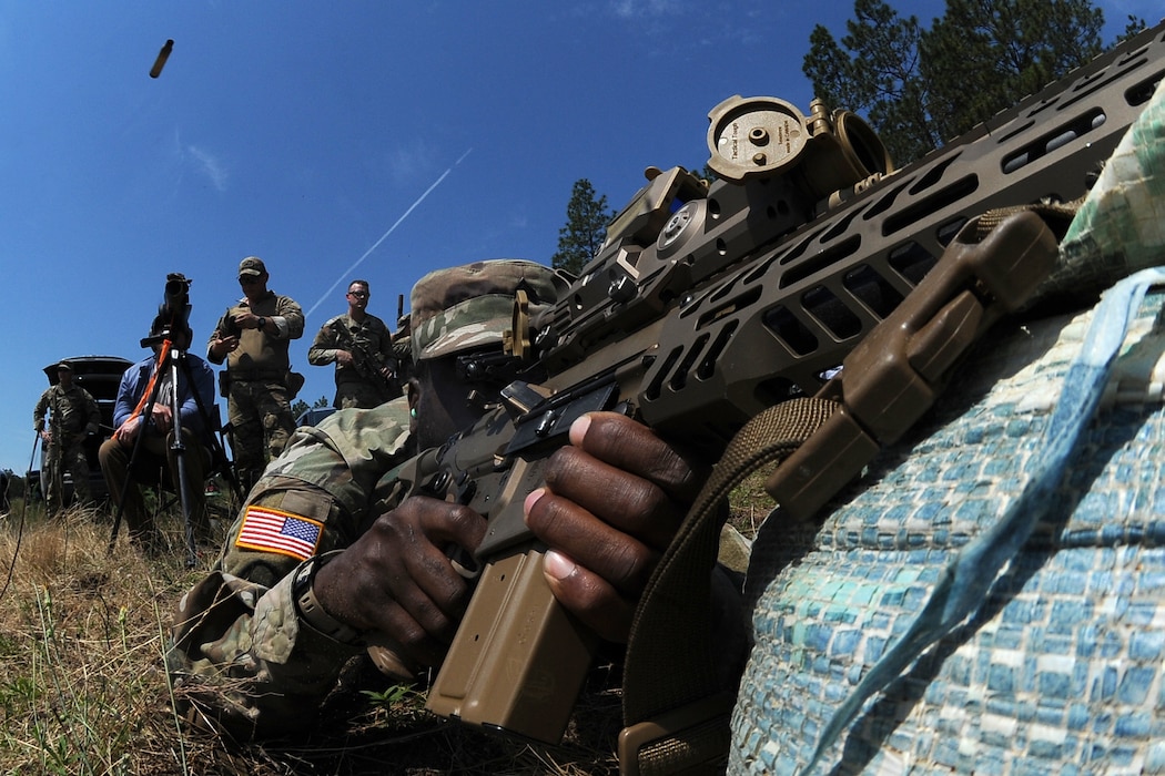 U.S. Army Sgt. Shandell Green, a scout with B Company, 1st Squadron, 150th Cavalry Regiment, West Virginia Army National Guard, engages targets with the XM7 rifle and XM157 scope, part of the Next Generation Squad Weapon system, during testing of the rifle and scope at Fort Liberty, North Carolina, June 13, 2024. The system includes the XM7 rifle, the XM250 automatic rifle, and the XM157 fire control system, which are designed to replace the current M4 carbine, M249 Squad Automatic Weapon, and the M240 machine gun.