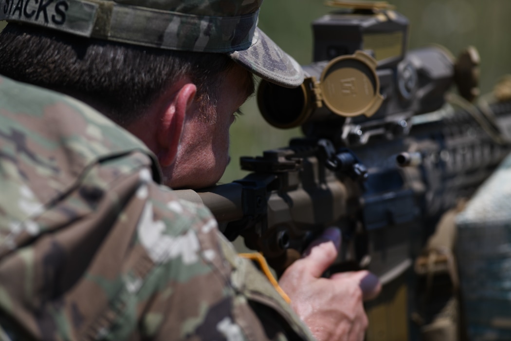 U.S. Army Sgt. 1st Class Bradley Stacks, with Headquarters and Headquarters Battery, 1st Battalion, 113th Field Artillery Regiment, North Carolina Army National Guard, engages targets with the XM7 rifle and XM157 scope during testing of the rifle and scope at Fort Liberty, North Carolina, as part of the Next Generation Squad Weapon system, June 13, 2024. The system includes the XM7 rifle, the XM250 automatic rifle, and the XM157 fire control system, which are designed to replace the current M4 carbine, M249 Squad Automatic Weapon, and the M240 machine gun.