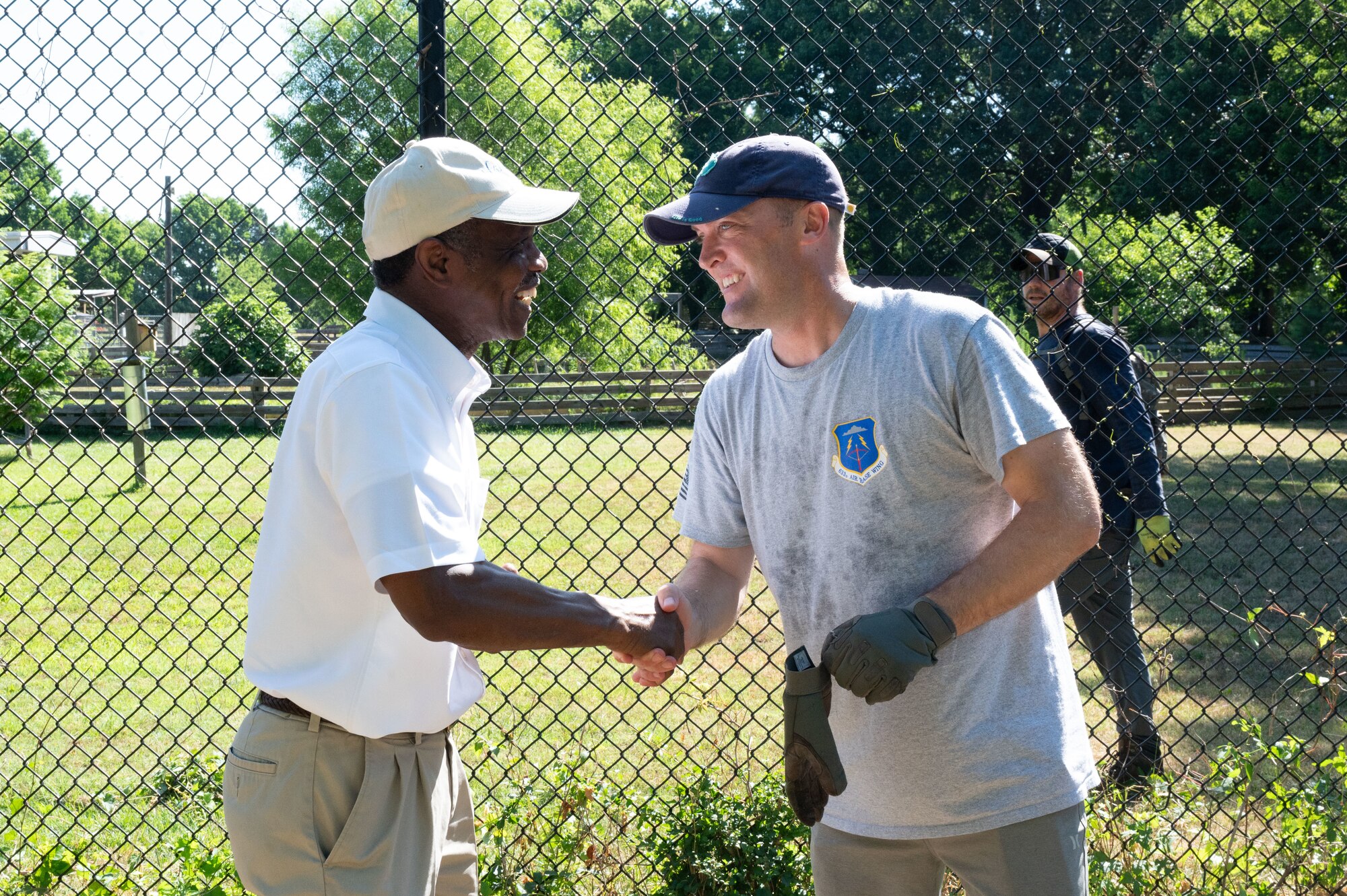 Mayor Donnie Tuck and Colonel Matthew Altman shake hands at the Blue Bird Gap Farm