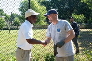 Mayor Donnie Tuck and Colonel Matthew Altman shake hands at the Blue Bird Gap Farm
