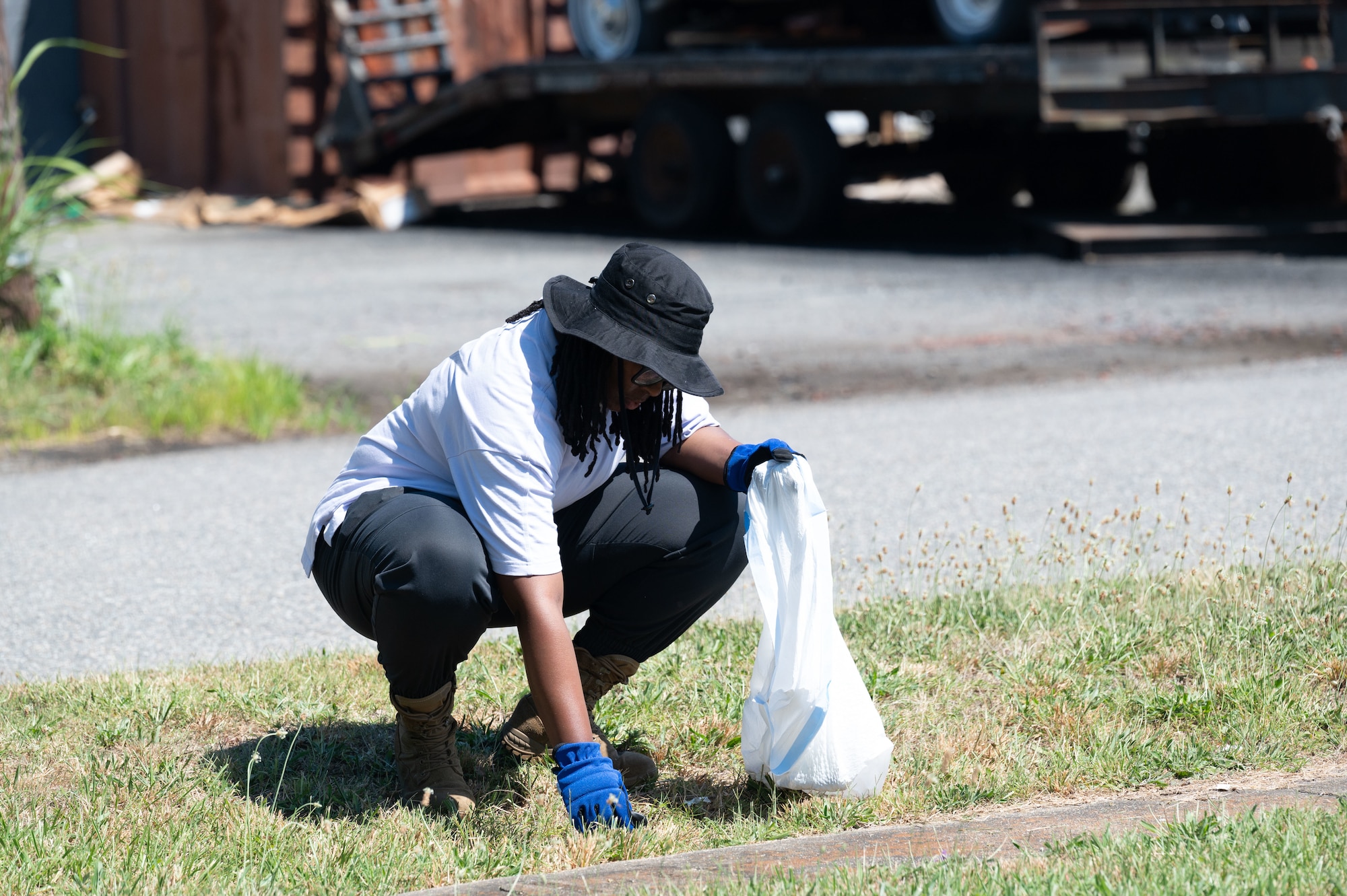 Airman stationed at JBLE cleans up litter at the historic Pleasant Shade Cemetery
