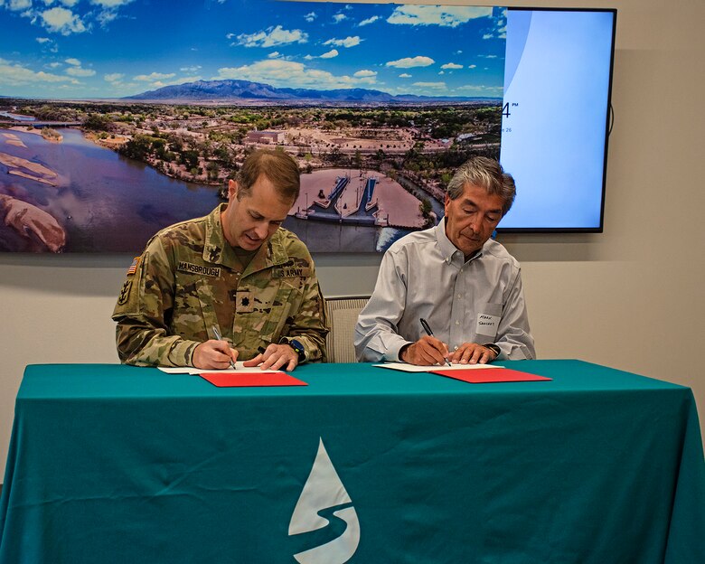 Lt. Col. Jerre Hansbrough, left, commander, USACE-Albuquerque District, and Mark Sanchez, executive director, Albuquerque Bernalillo County Water Utility Authority, signed a new water storage agreement for Abiquiu Reservoir at the Water Authority’s Customer Service Center in Albuquerque, N.M., June 26, 2024.
The agreement will allow Abiquiu Reservoir to store Rio Grande system water for the first time, functionally increasing Abiquiu Reservoir’s storage capacity from 200,000 acre feet to approximately 230,000 acre feet.