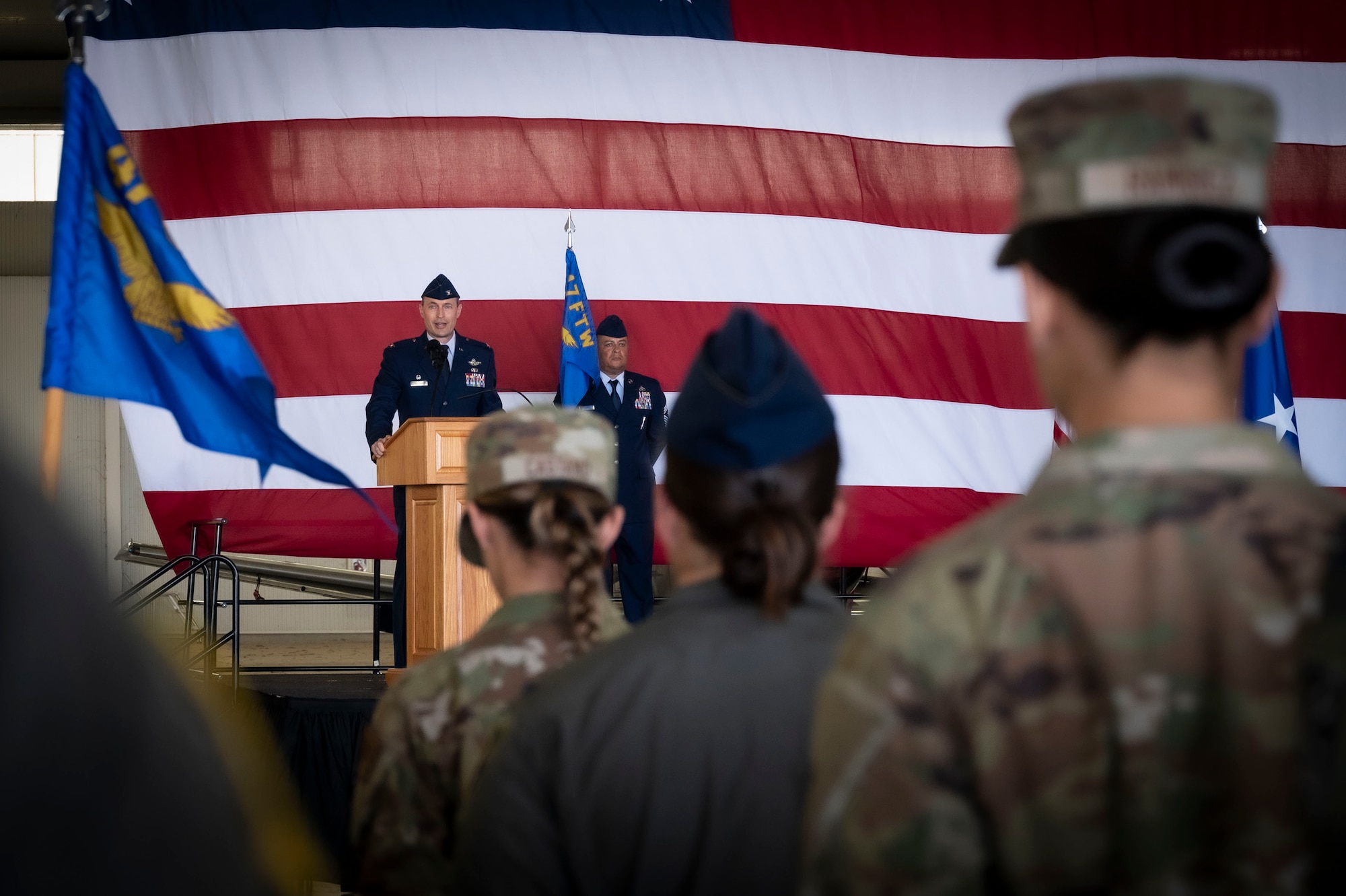 U.S. Air Force Col. Tyler Ellison, 47th Flying Training Wing (FTW) commander, delivers a speech to his new unit during the 47th FTW change of command ceremony at Laughlin Air Force Base, Texas, June 26, 2024. As commander, Ellison will oversee nearly 2,800 military and civilian personnel engaged in executing more than 61,000 aircraft sororities yearly in support of Laughlin’s Undergraduate Pilot Training mission. (U.S. Air Force photo by Senior Airman Kailee Reynolds)