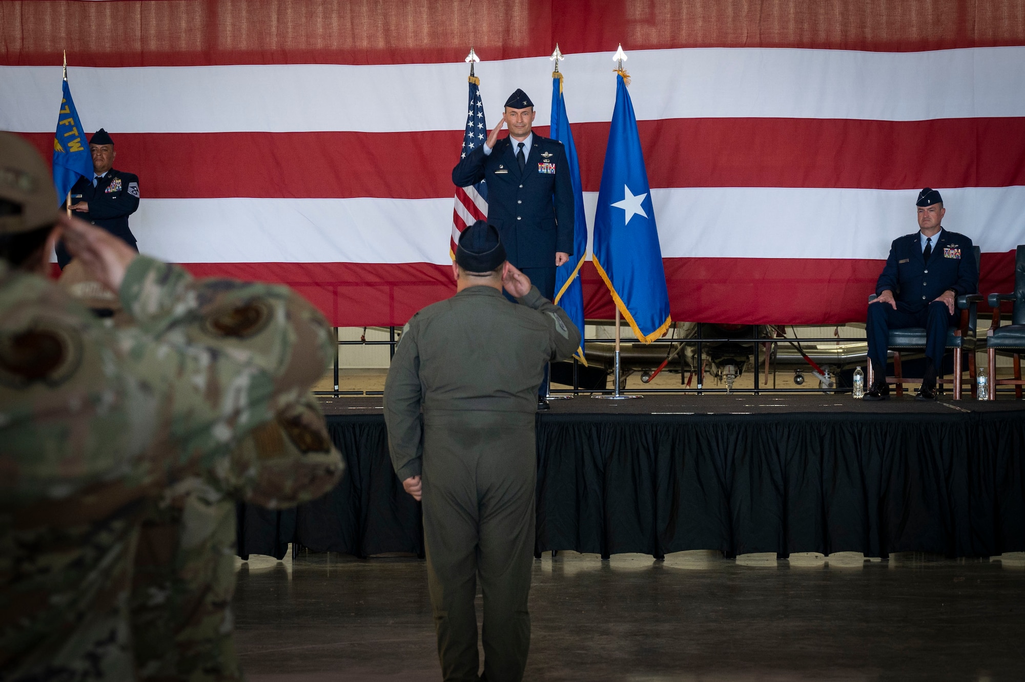 U.S. Air Force Col. Tyler Ellison (middle), 47th Flying Training Wing (FTW) commander, gives his first salute as commander to his unit during the 47th FTW change of command ceremony at Laughlin Air Force Base, Texas, June 26, 2024. As commander, Ellison will oversee nearly 2,800 military and civilian personnel engaged in executing more than 61,000 aircraft sororities yearly in support of Laughlin’s Undergraduate Pilot Training mission. (U.S. Air Force photo by Senior Airman Kailee Reynolds)