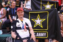 U.S. Army Maj. Jeremy Ditlevson cheers on Team Army at the wheelchair basketball game