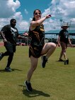 U.S. Army 1st Lt. Victoria Rollin conducts warm-up drills at track practice