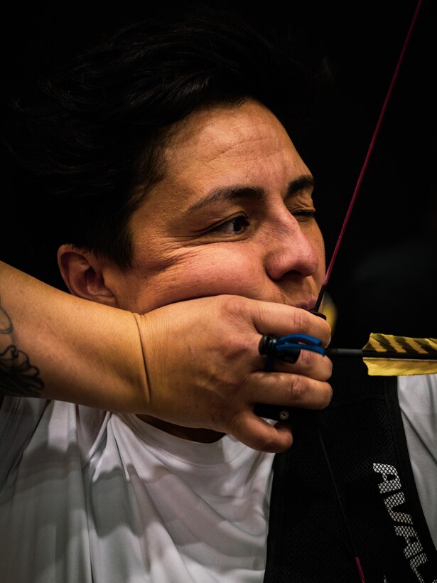 U.S. Army Spc. Berenice Carmona draws her bow at archery practice