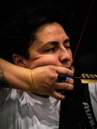 U.S. Army Spc. Berenice Carmona draws her bow at archery practice