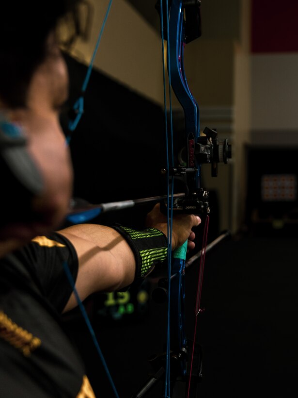 U.S. Army Spc. Berenice Carmona draws her bow at archery practice