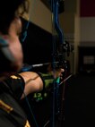 U.S. Army Spc. Berenice Carmona draws her bow at archery practice