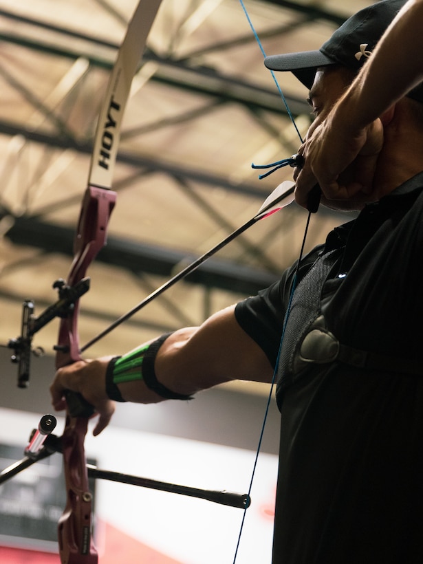 U.S. Army 1st Lt. Matthew Hovey draws his recurve bow at archery practice