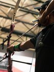 U.S. Army 1st Lt. Matthew Hovey draws his recurve bow at archery practice