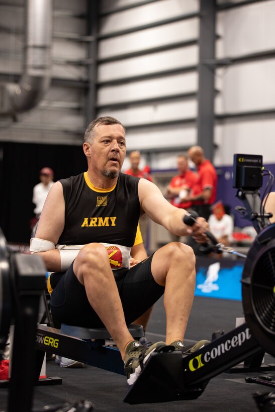 U.S. Army Maj. Jeremy Ditlevson competes in indoor rowing