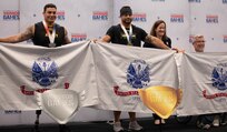 U.S. Army veterans Jason Smith, right, Shawn Lee, center, and Christopher Parks, far right pose for a photo after sweeping the medals for the 1 minute race at the indoor rowing event