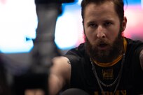 U.S. Army veteran Patrick Dayton competes in the indoor rowing even