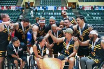 Team Army athletes celebrate after winning the bronze medal in wheelchair rugby