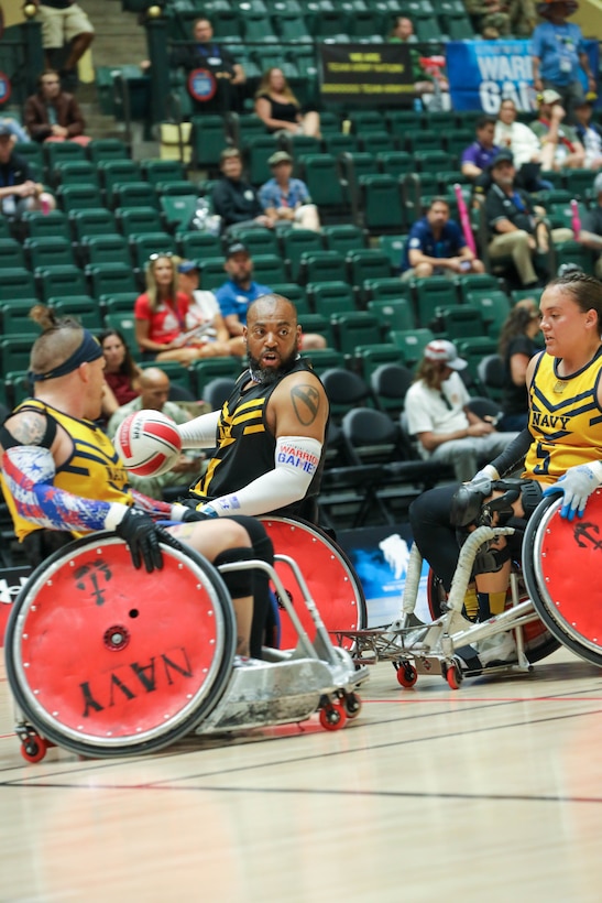 U.S. Army veteran Brent Garlic looks for an opening in a wheelchair rugby match