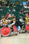 U.S. Army veteran Brent Garlic looks for an opening in a wheelchair rugby match