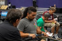 U.S. Army veteran Justin Mathers participates in indoor rowing practice