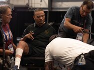 U.S. Army Cpt. Luis Avila prepares for indoor rowing familiarization