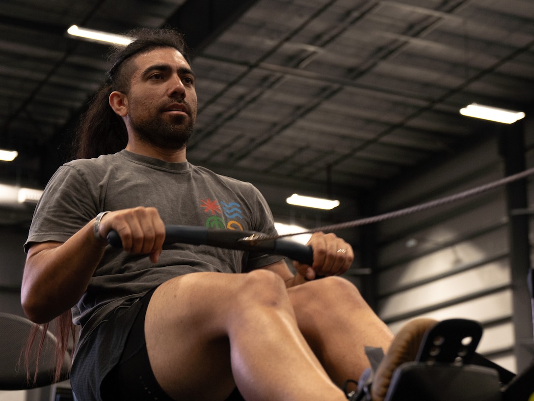 U.S. Army veteran Justin Mathers puts in some practice time at indoor rowing familiarization
