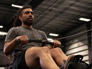 U.S. Army veteran Justin Mathers puts in some practice time at indoor rowing familiarization