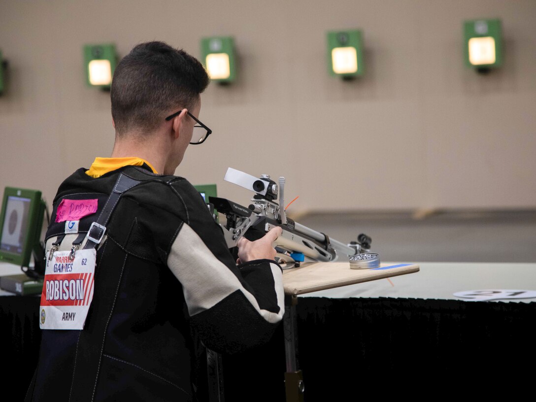 U.S. Army Sgt. Alexander Robison prepares to compete in the precision air event during the 2024 Department of Defense Warrior Games