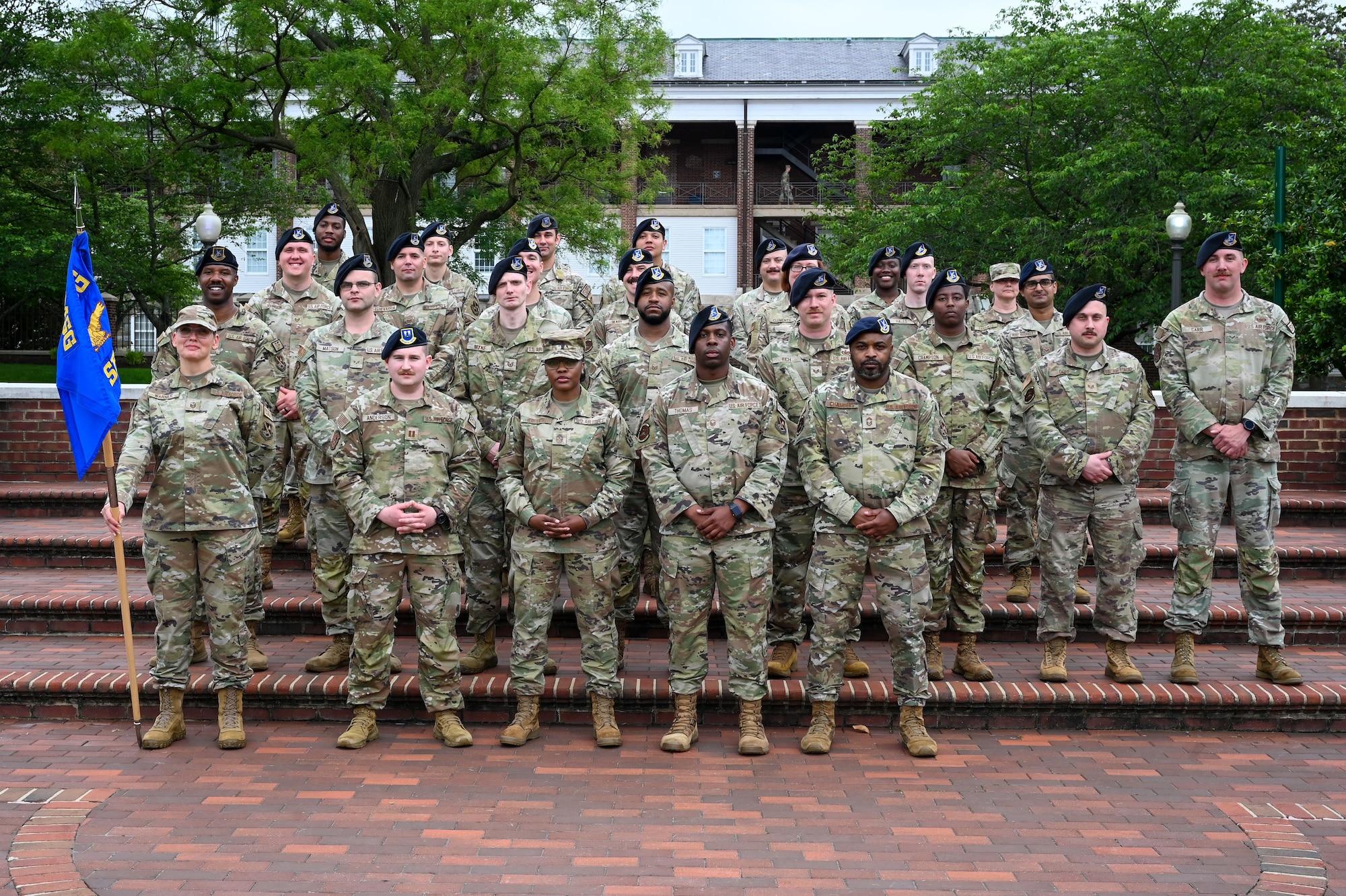 Members of the 11th Security Forces Squadron pose with Chief Master Sgt. Charmaine Kelley, Command Chief Master Sergeant for the Air Force District of Washington and the 320th Air Expeditionary Wing, during the closing ceremony of National Police Week on Joint Base Anacostia-Bolling, Washington, D.C., May 17, 2024. The ceremony featured a somber rendition of Taps and an evocative speech from Kelley, reflecting on the ultimate sacrifice that her father paid while serving. (U.S. Air Force photo by Airman Shanel Toussaint)