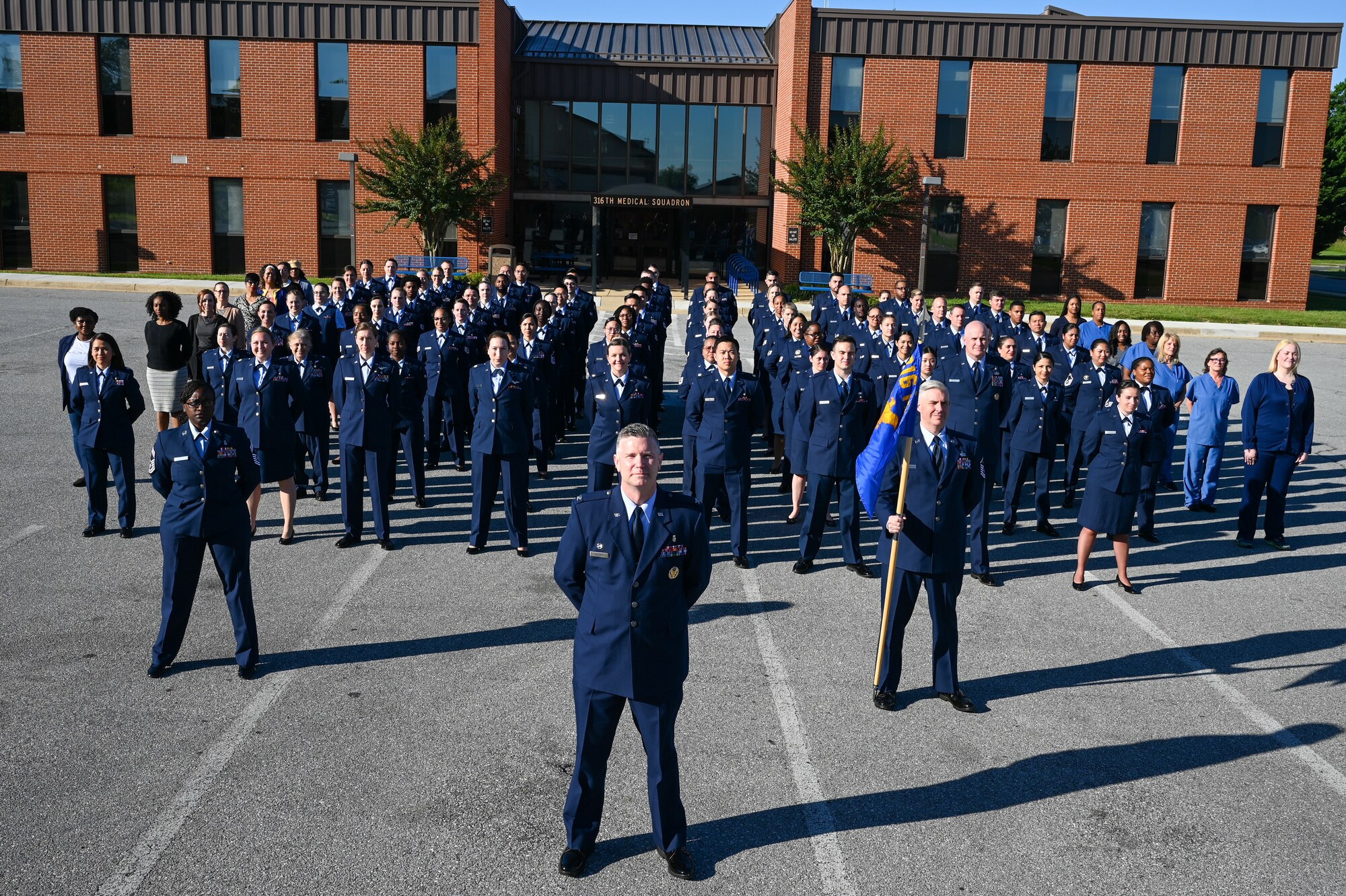 Members of the 316th Medical Squadron at Joint Base Anacostia-Bolling pose for a photo in front of the Bolling Medical Center at JBAB, Washington, D.C., May 31, 2024. This photo session preceded a surprise retirement event for Lt. Col. Marilyn Perry, who has served 35 years in the Air Force as a medical provider. (U.S. Air Force photo by Airman Shanel Toussaint)