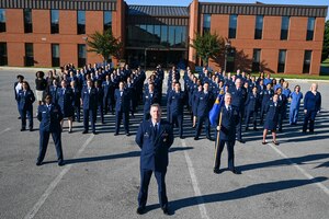 Members of the 316th Medical Squadron at Joint Base Anacostia-Bolling pose for a photo in front of the Bolling Medical Center at JBAB, Washington, D.C., May 31, 2024. This photo session preceded a surprise retirement event for Lt. Col. Marilyn Perry, who has served 35 years in the Air Force as a medical provider. (U.S. Air Force photo by Airman Shanel Toussaint)