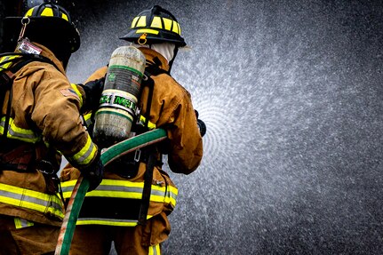 Firefighters spraying water