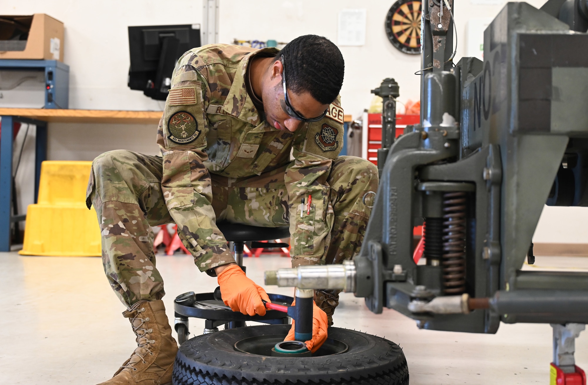 U.S. Air Force Airman 1st Class Ryan Ellison, an aerospace ground equipment journeyman with the 62d Maintenance Squadron, replaces a seal on a nose landing gear trailer tire at Joint Base Lewis-McChord, Washington, June 25, 2024. By sealing the tires on the trailer, AGE Airmen ensure the stability and maneuverability of the nose landing gear trailer, contributing to the overall safety during aircraft maintenance tasks. (U.S. Air Force photo by Airman 1st Class Kylee Tyus)