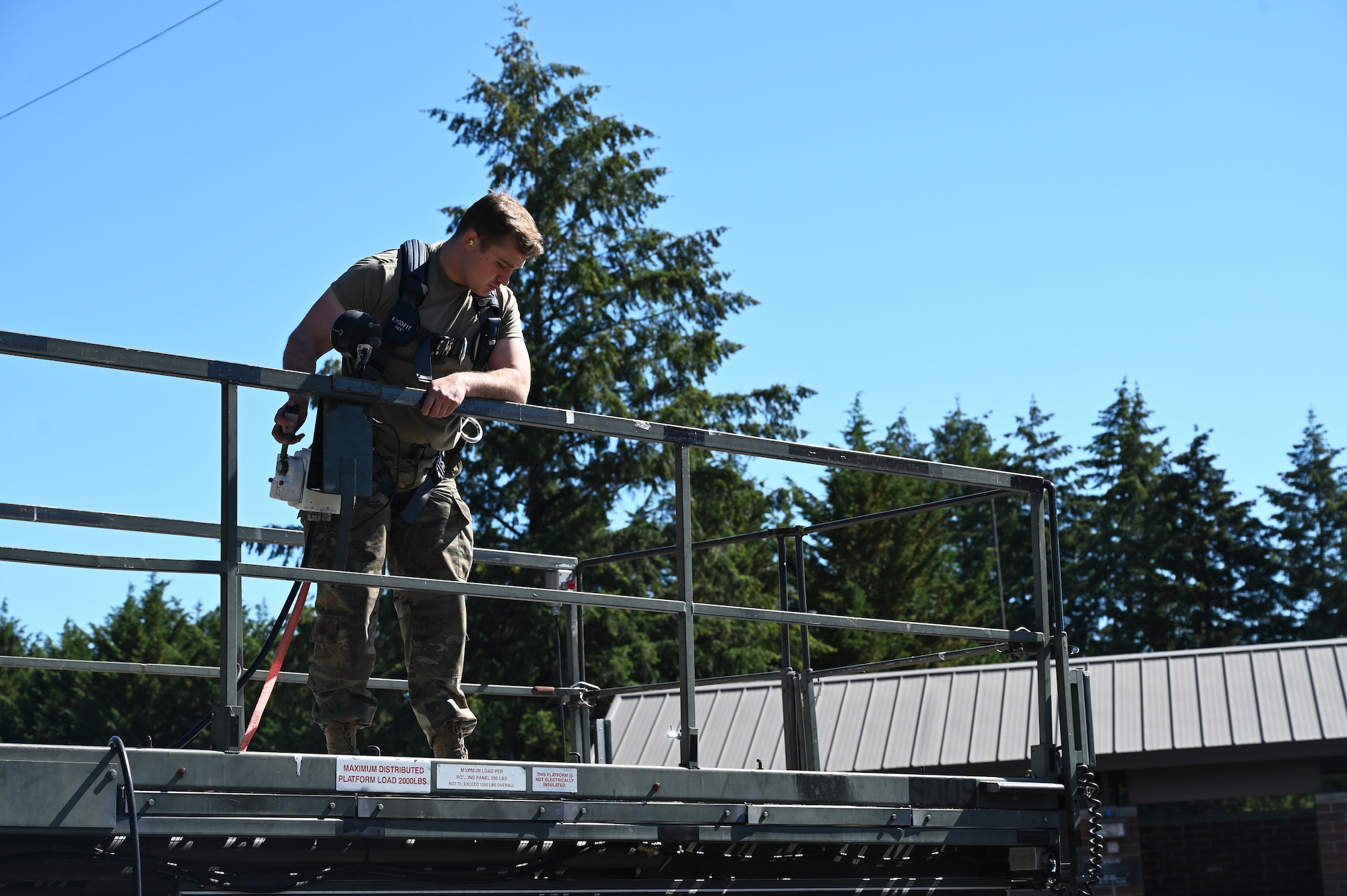 U.S. Air Force Staff Sgt. Quincy Osterlund, an aerospace ground equipment journeyman with the 62d Aircraft Maintenance Squadron, performs a routine inspection on a split deck at Joint Base Lewis-McChord, Washington, June 25, 2024. AGE Airmen conduct routine maintenance on equipment to ensure all systems work appropriately before sending them to the flightline. (U.S. Air Force photo by Airman 1st Class Kylee Tyus)