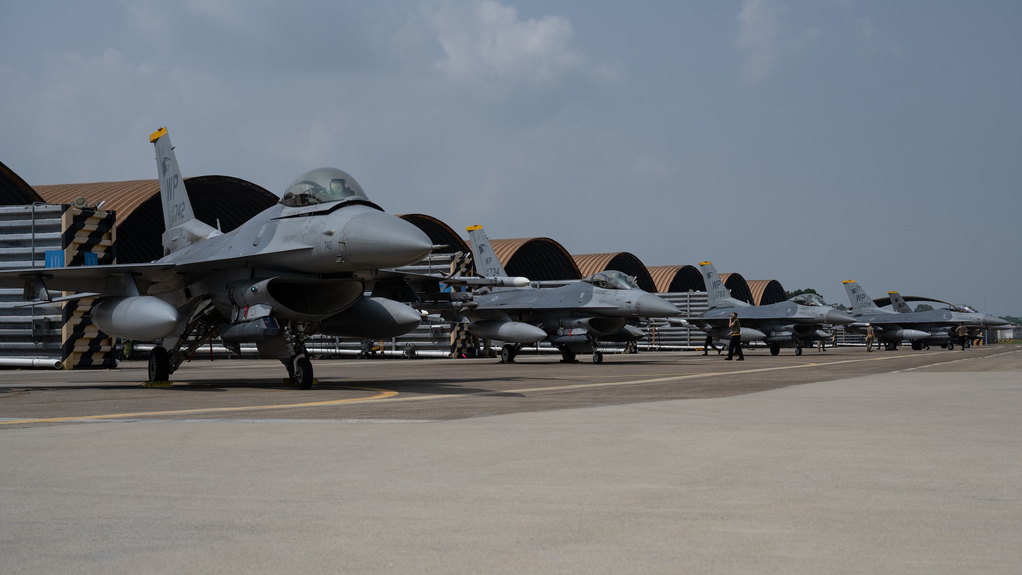 Five F-16 Fighting Falcon aircraft, assigned to the 80th Fighter Squadron, are parked on the flightline during Buddy Squadron 24-4.