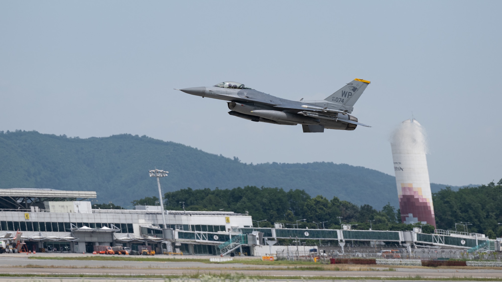 An F-16 Fighting Falcon aircraft, assigned to the 80th Fighter Squadron, takes off.
