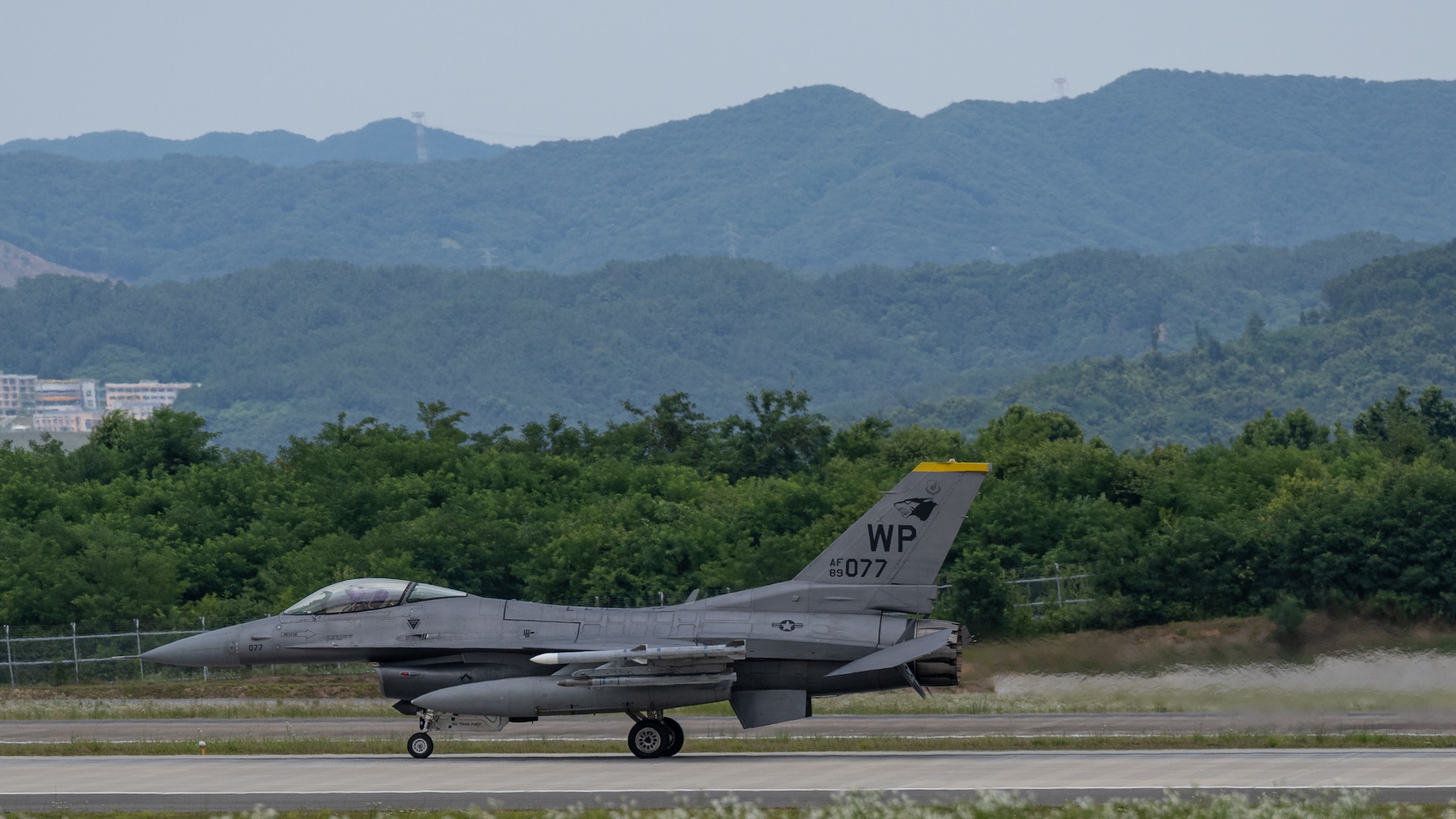 An F-16 Fighting Falcon aircraft, assigned to the 80th Fighter Squadron, lands.
