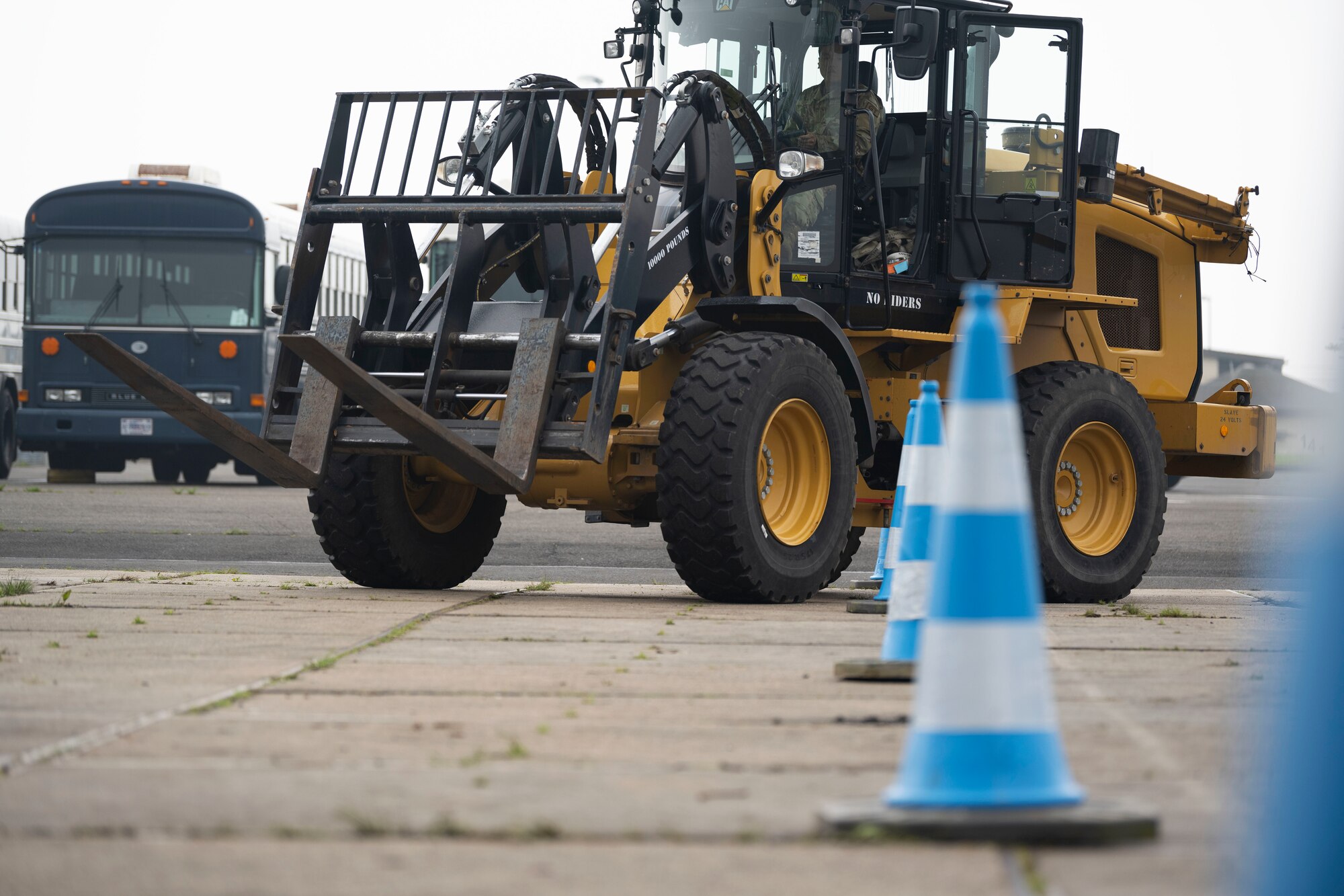 U.S. Air Force Airman Basic Keyan Gebin, a ground transportation operator apprentice, assigned to the 52nd Logistics Readiness Squadron, operates a 10K all-terrain forklift through obstacles at Spangdahlem Air Base, Germany, May 8, 2024. The 156th LRS integrated with the 52nd LRS as a force multiplier, assisting with daily operations, augmenting capabilities in support of the 52nd Fighter Wing Saber Knight Readiness Exercise 24-01 and exchanging best practices during training. (U.S. Air National Guard photo by Master Sgt. Rafael D. Rosa)