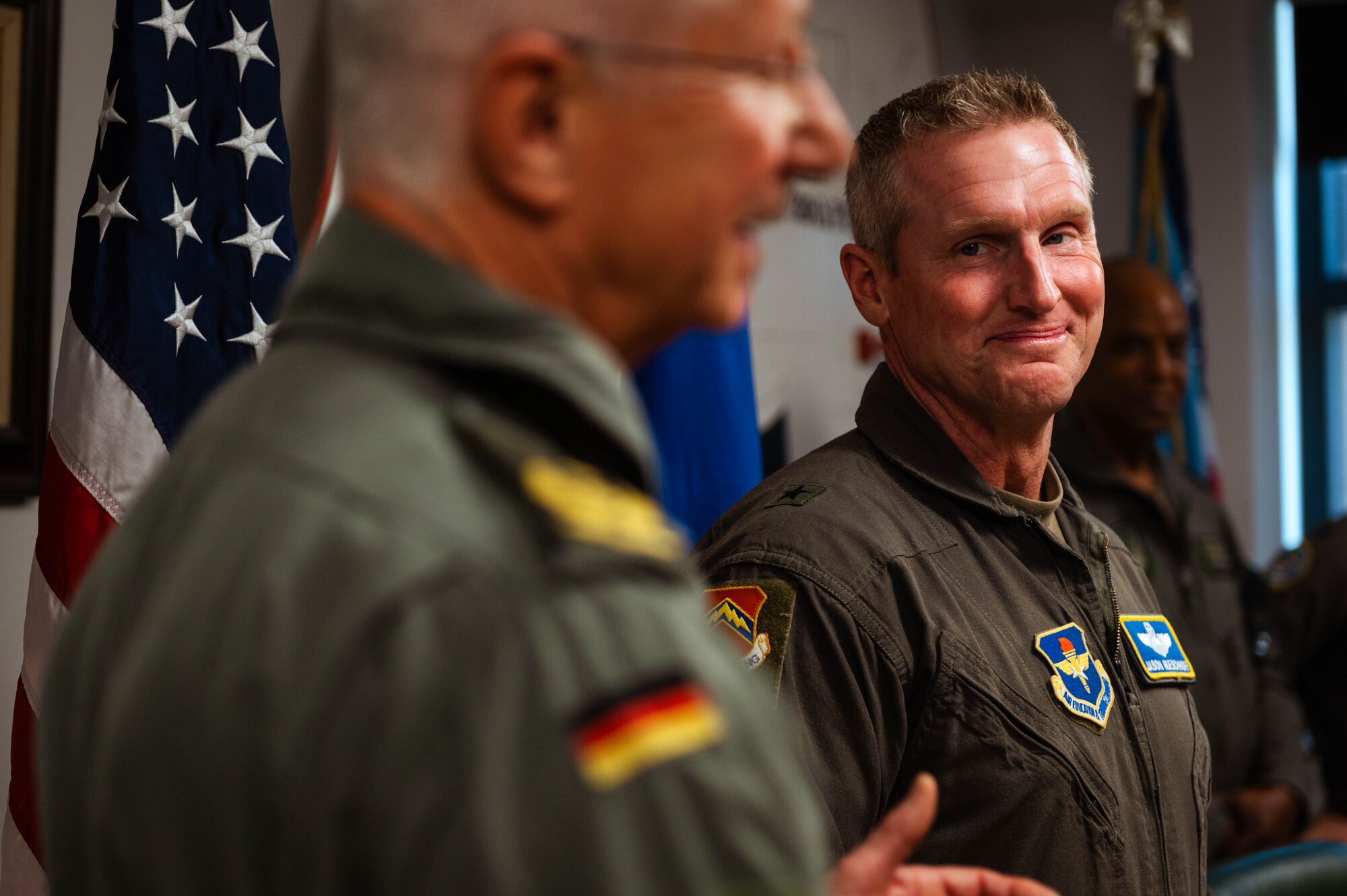 U.S. Air Force Brig. Gen. Jason Rueschhoff (right), 56th Fighter Wing commander, looks to German Air Forces Maj. Gen. Peter Klement (left), GAF’s Flying Unit commander, following the signing of a decree of honor between the Airmen of the 310th Fighter Squadron and the 2nd Flying Squadron of the Tactical Air Wing 33.