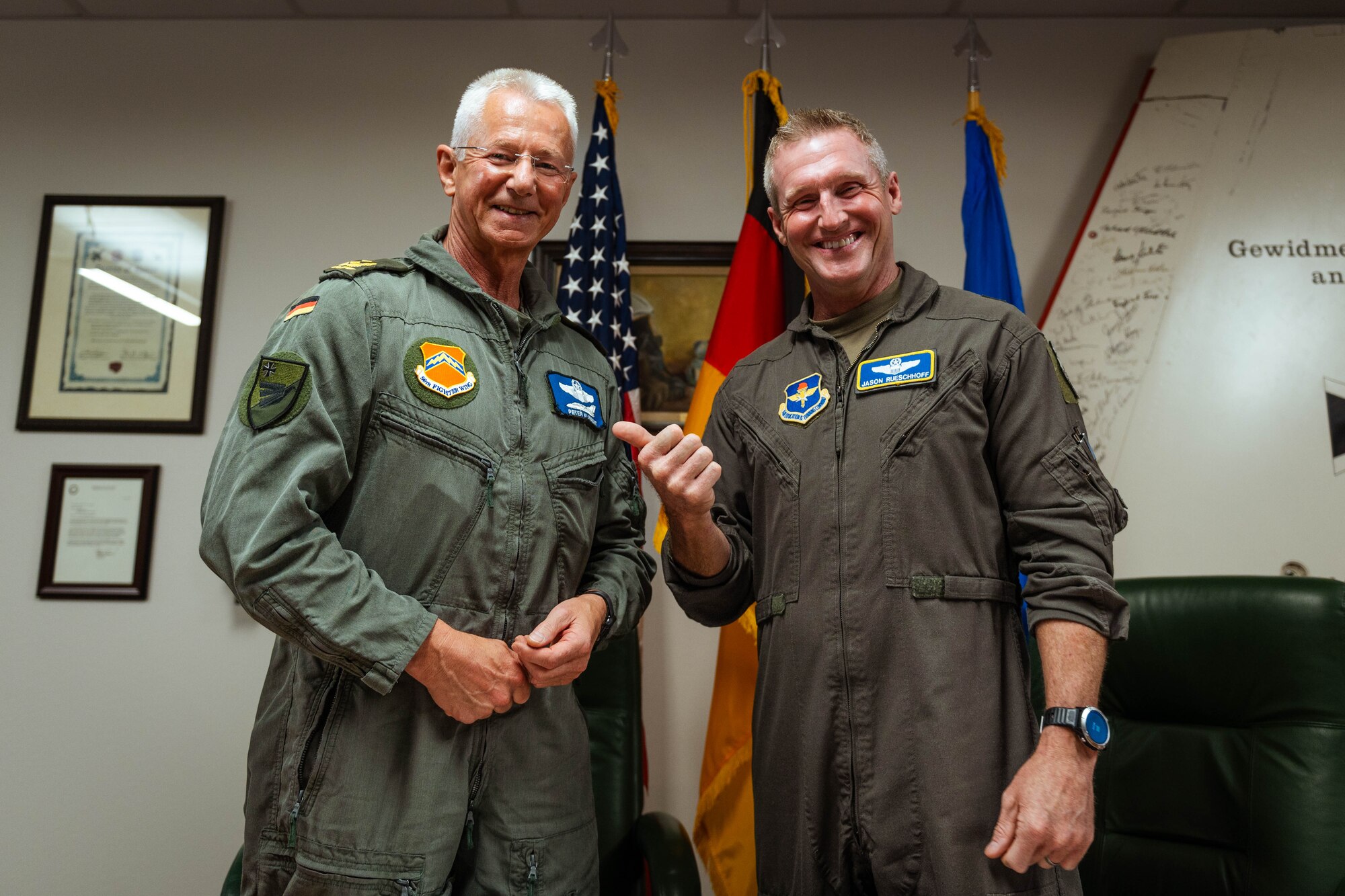 German Air Forces Maj. Gen. Peter Klement (left), GAF’s Flying Unit commander, stands with U.S. Air Force Brig. Gen. Jason Rueschhoff (right), 56th Fighter Wing commander following the signing of a decree of honor between the Airmen of the 310th Fighter Squadron and the 2nd Flying Squadron of the Tactical Air Wing 33.
