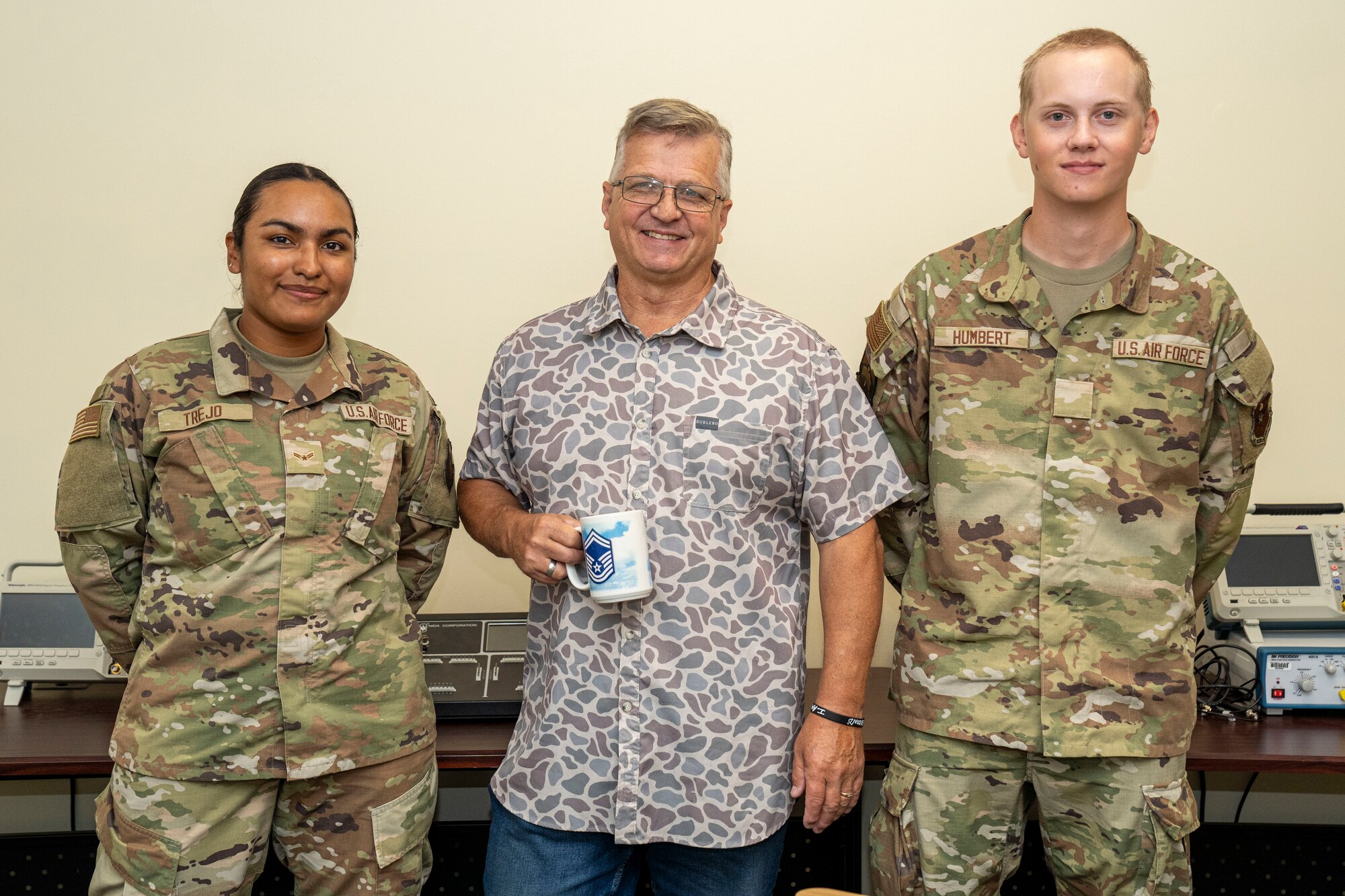U.S. Air Force Airman 1st Class Rocio Trejo, 334th Training Squadron Radar, Airfield & Weather Systems Specialist student, James Chapman, 334th TRS RAWS instructor, and Airman Basic Quintin Humbert, 334th TRS RAWS student, pose for a photo on Keesler Air Force Base, Mississippi, June 20, 2024.