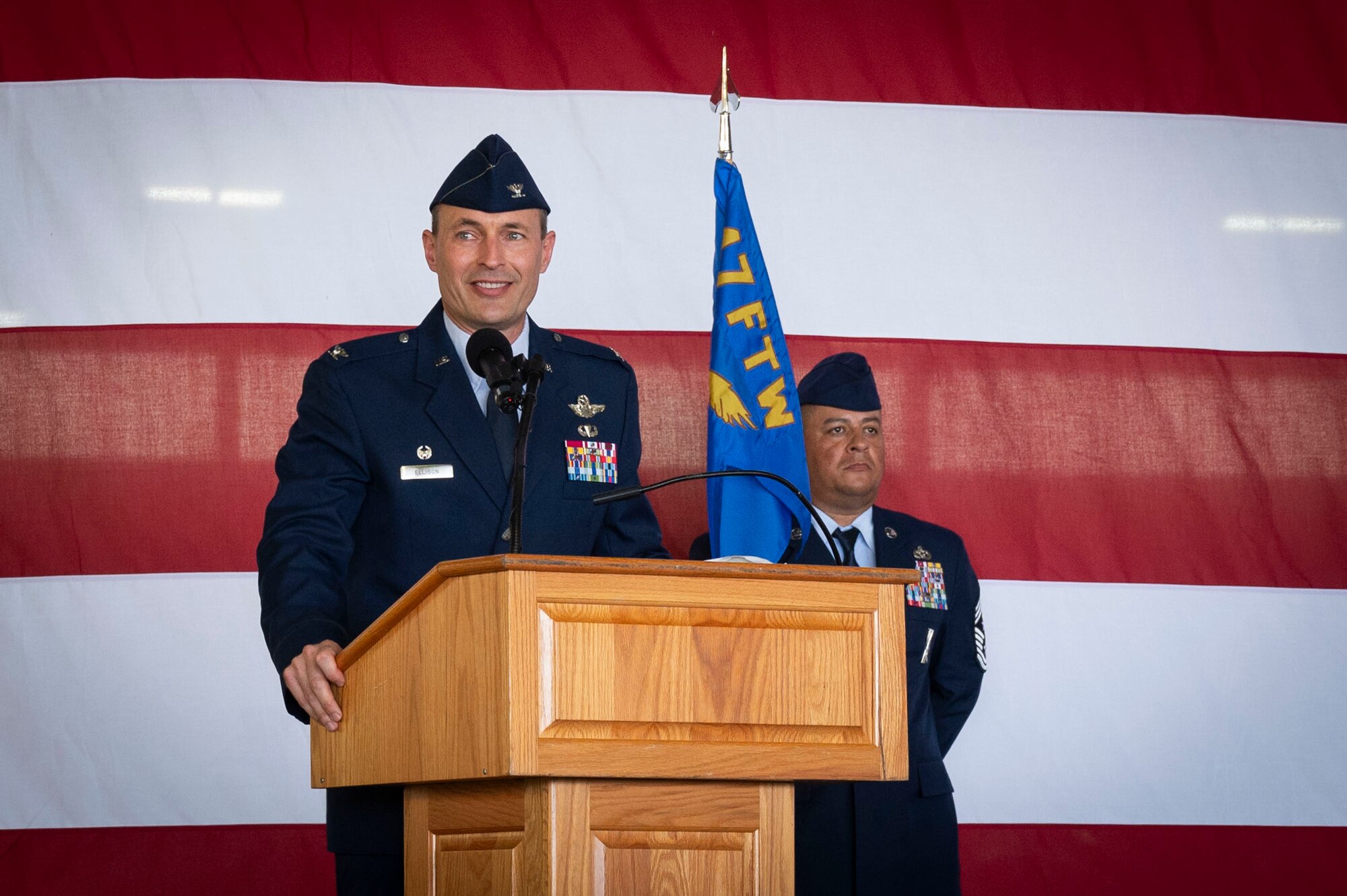 U.S. Air Force Col. Tyler Ellison, 47th Flying Training Wing (FTW) commander, delivers a speech during the 47th FTW change of command ceremony at Laughlin Air Force Base, Texas, June 26, 2024. As commander, Ellison will oversee nearly 2,800 military and civilian personnel engaged in executing more than 61,000 aircraft sororities yearly in support of Laughlin’s Undergraduate Pilot Training mission. (U.S. Air Force photo by Senior Airman Kailee Reynolds)