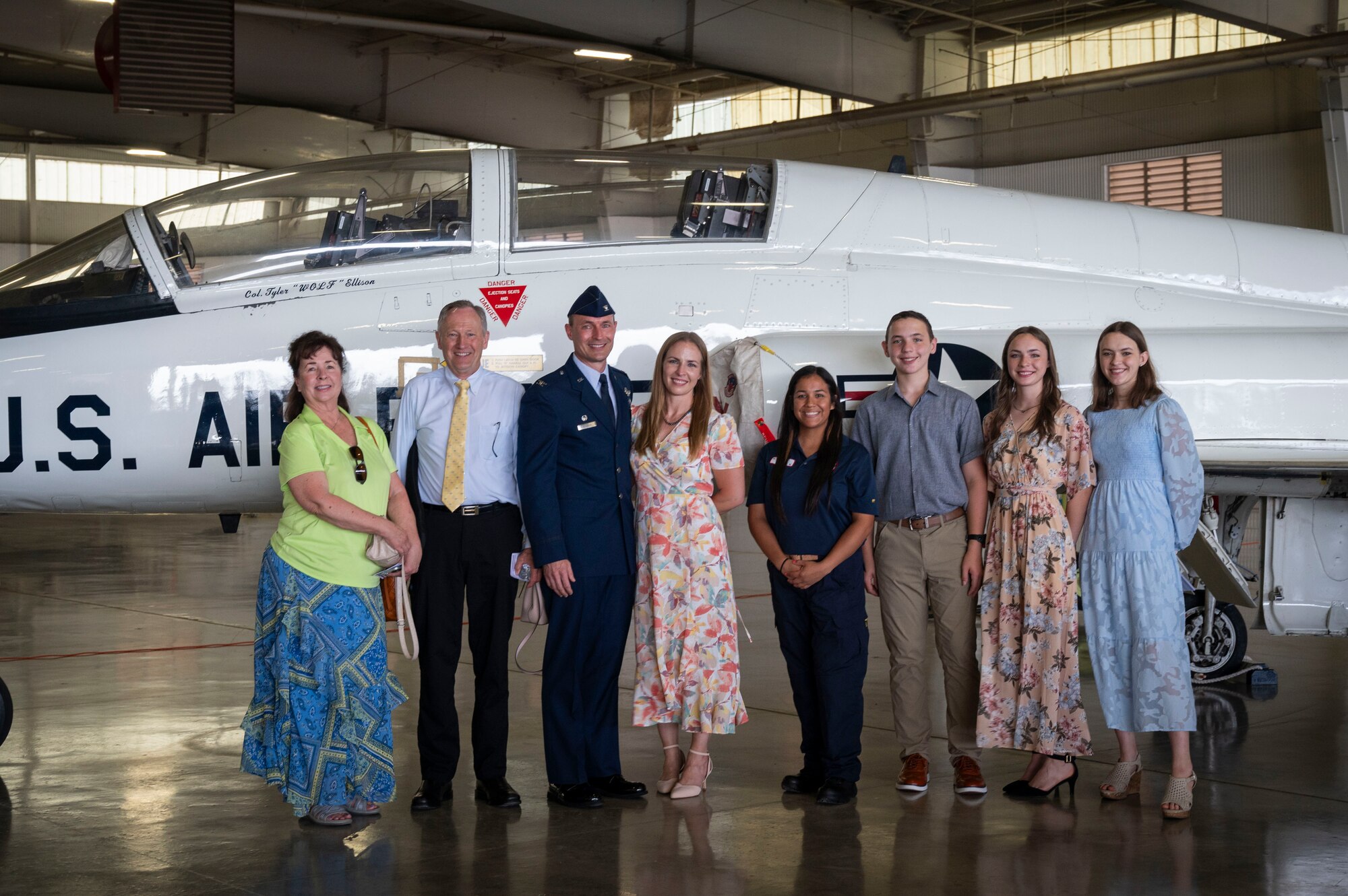 U.S. Air Force Col. Tyler Ellison (middle), 47th Flying Training Wing (FTW) commander, poses with his family and Mary Zuniga, 47th Maintenance Directorate dedicated crew chief, in front of the 47th FTW flagship bearing his name during the 47th FTW change of command ceremony at Laughlin Air Force Base, Texas, June 26, 2024. Ellison accepted the role as the 47th FTW commander from former commander Col. Kevin Davidson. (U.S. Air Force photo by Senior Airman Kailee Reynolds)